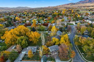 Aerial view of residential area featuring a mountainous background