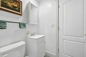 Bathroom featuring vanity and toilet