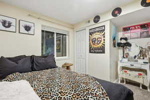 Bedroom with carpet floors and a closet