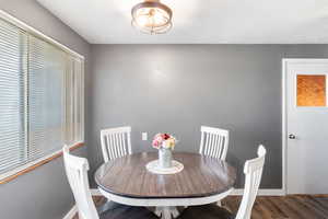 Dining area with wood finished floors and baseboards