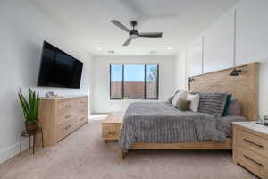 Bedroom featuring light colored carpet and ceiling fan