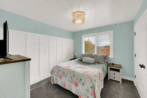 Bedroom with dark carpet