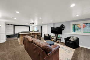 Cinema room with recessed lighting and baseboards
