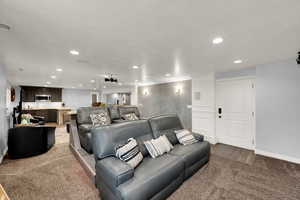 Home theater room featuring recessed lighting and light carpet