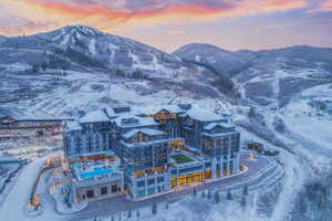 Snowy aerial view featuring a mountain view