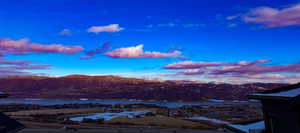 View of mountain backdrop featuring a large body of water