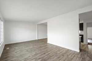 Spare room with wood finished floors