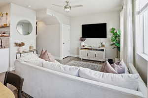 Living room with ceiling fan and wood finished floors