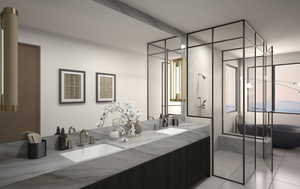 Primary bathroom with double vanity, light tile patterned floors, soaking tub & shower.