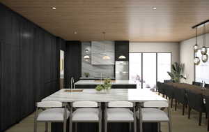 Kitchen with Wolf appliances & dining area with mountain & lake views.