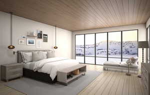 Primary suite with hardwood floors, wood ceilings, and forever views.