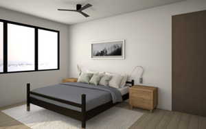 Guest suite 1 featuring hardwood floors and a ceiling fan.