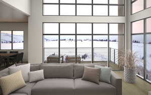 2-story great room with a wood-burning fireplace and a deck with forever views.