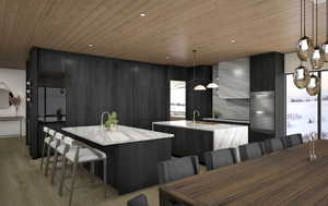 Kitchen with Wolf appliances & dining area with mountain & lake views.