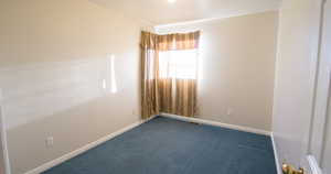 Spare room with carpet floors and baseboards