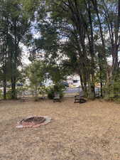 View of yard featuring a fire pit. Yard, North side
