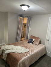 Bedroom featuring carpet flooring. APT 1