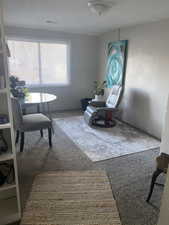 Sitting room with carpet. APT 1