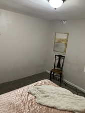 Bedroom featuring carpet and baseboards. APT 1