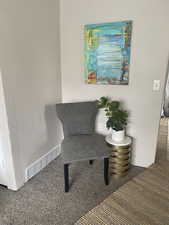 Sitting room with carpet. APT 1