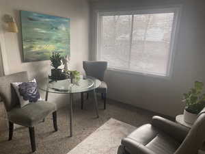 Living area featuring carpet floors. APT 1