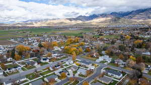 View of property location featuring nearby suburban area and a mountainous background