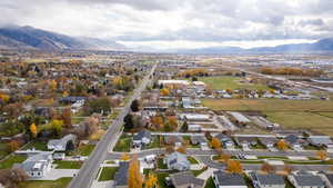 View of property location with mountains and nearby suburban area