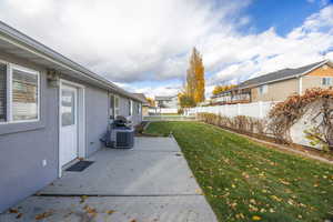 Fenced backyard with a patio and a residential view