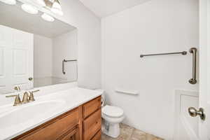 Bathroom featuring vanity and light tile patterned flooring