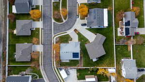 Aerial view of property's location with nearby suburban area