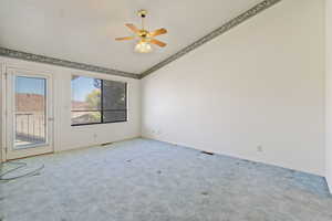 Large main-level master bedroom with walk-out patio, private bath, and walk-in closet.