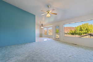 Large open family room with huge windows, views, and walk walk-out covered deck.