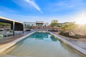 View of pool featuring a patio area and a fenced backyard