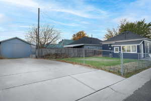 View of patio with a fenced front yard