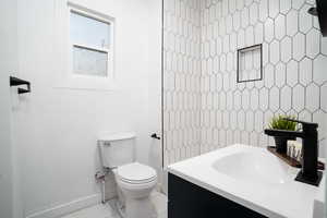 Bathroom with vanity and light tile patterned flooring