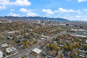 Aerial view of property's location with a mountain backdrop and nearby urban area