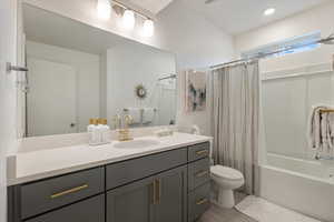 Full bath with vanity and shower / bath combo