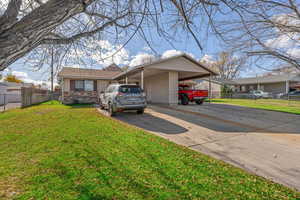 View of front of house featuring concrete driveway