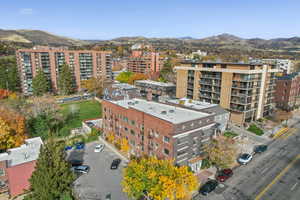 Drone / aerial view of apartment complex and mountains