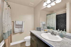 Full bath featuring vanity and tiled shower / bath combo