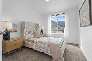 Carpeted bedroom featuring a mountain view and recessed lighting