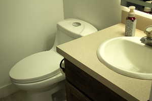 Bathroom with vanity and toilet