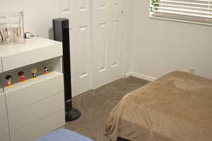 Bedroom with carpet and baseboards