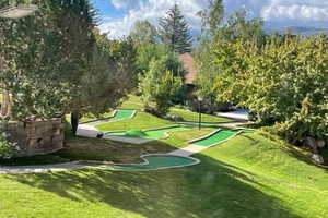 View of home's community with a yard and view of scattered trees