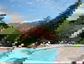 Community pool featuring a patio area and a mountain view