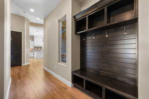 Mudroom featuring recessed lighting and light wood finished floors