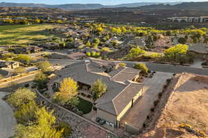 Aerial perspective of suburban area featuring a mountain backdrop