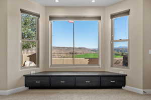 Detailed view of carpet flooring and recessed lighting