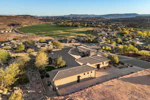 Aerial perspective of suburban area featuring a mountainous background