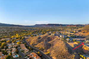 Aerial perspective of suburban area featuring a mountainous background